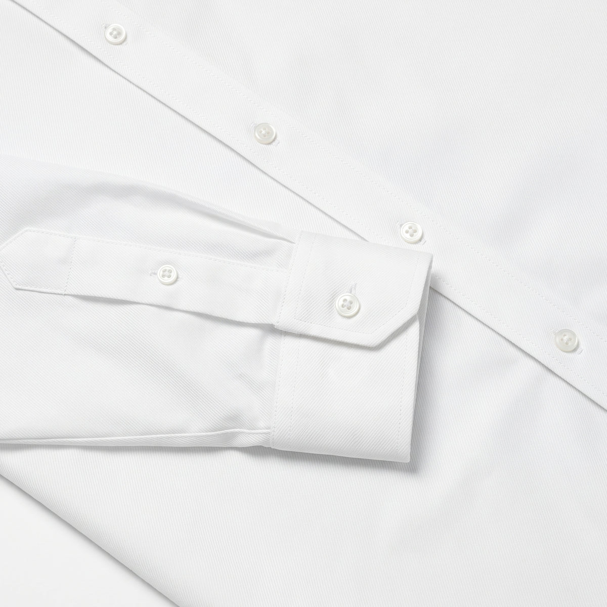 White twill dress shirt buttoned cuff and sleeve placket detail