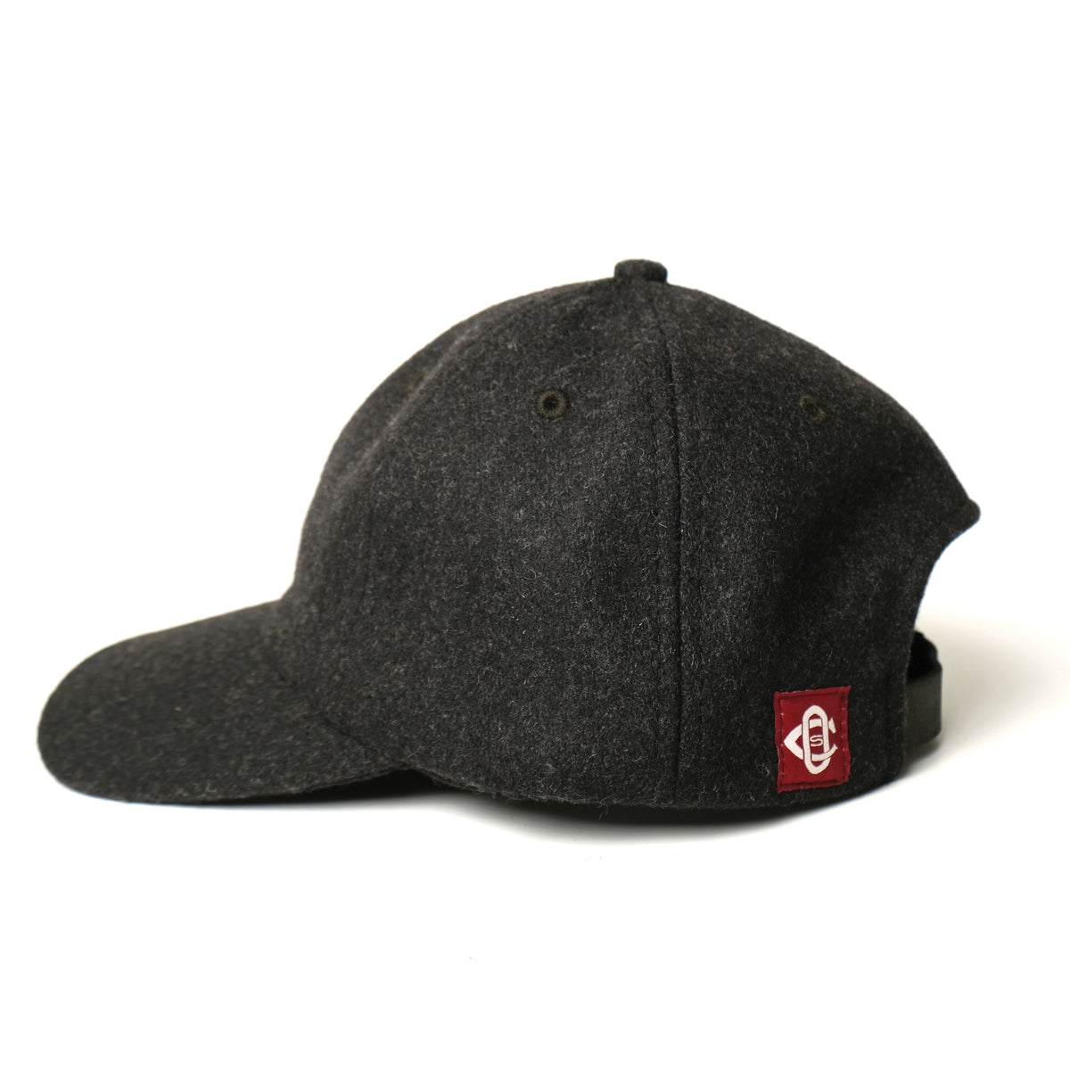Dark charcoal wool field cap with side logo patch and curved brim