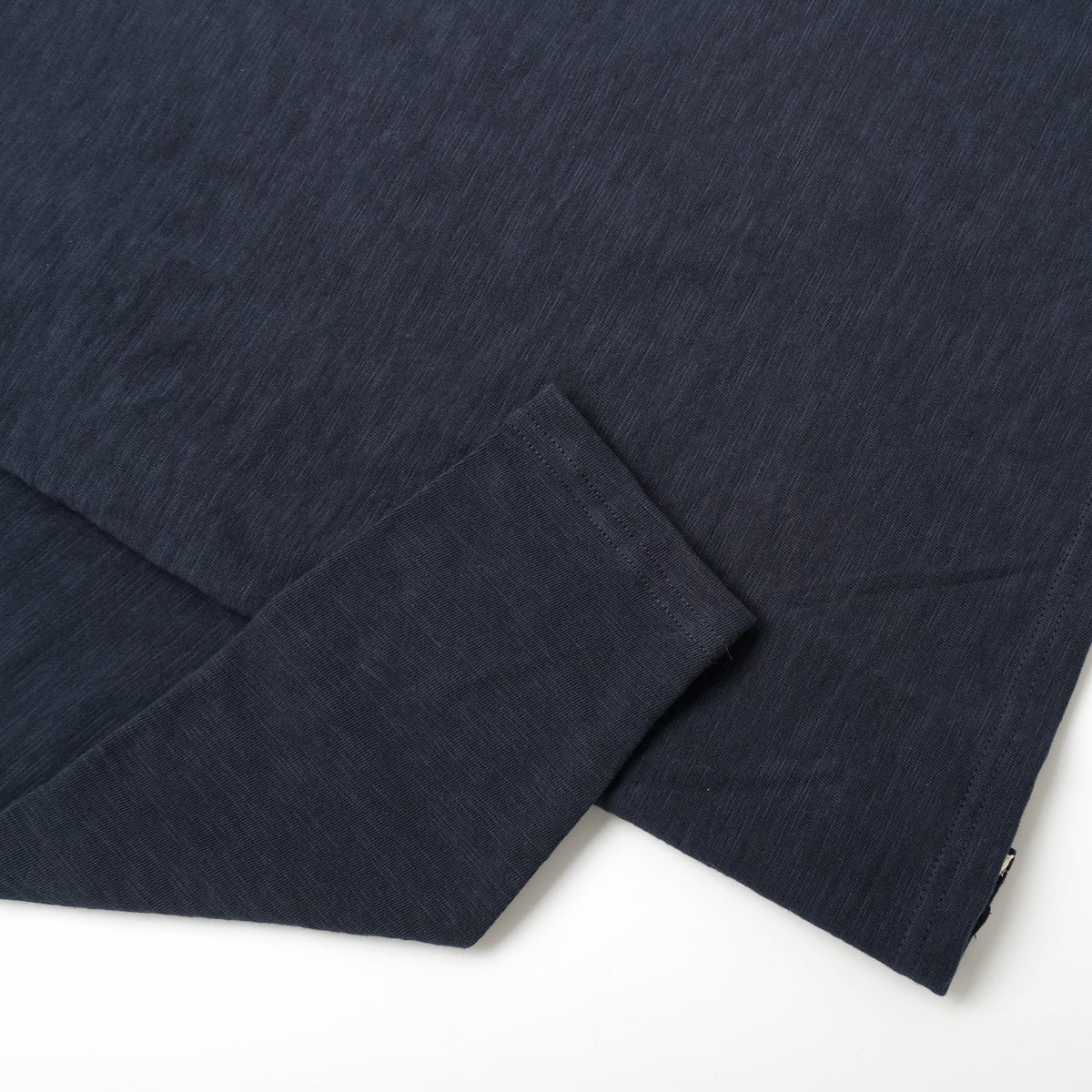 Navy long-sleeve T-shirt hem and sleeve cuff detail