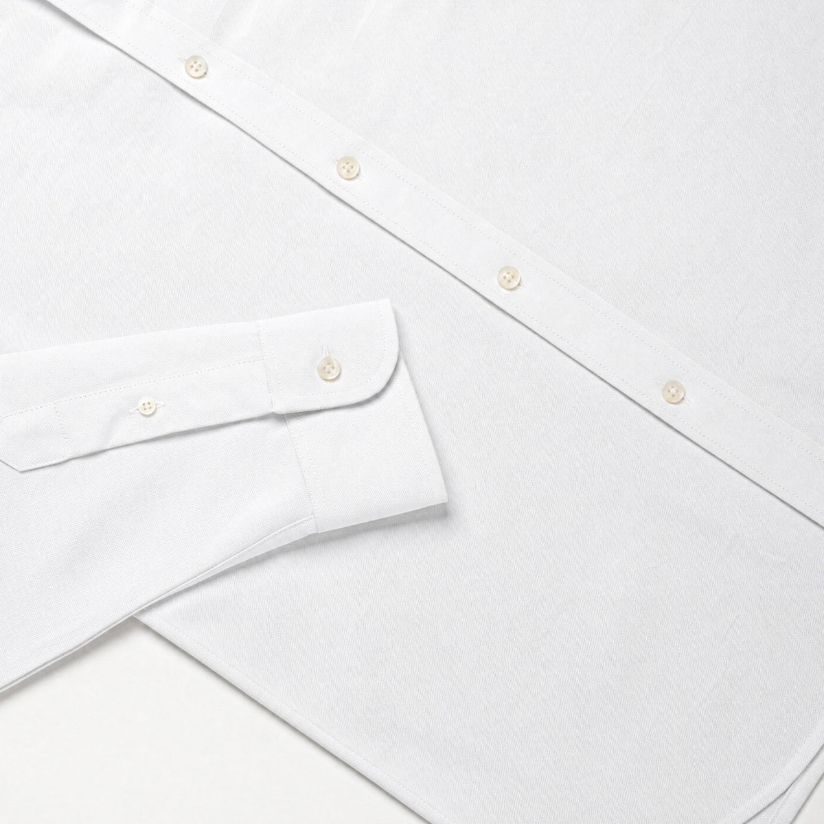 White Oxford shirt detail with curved yoke and button placket