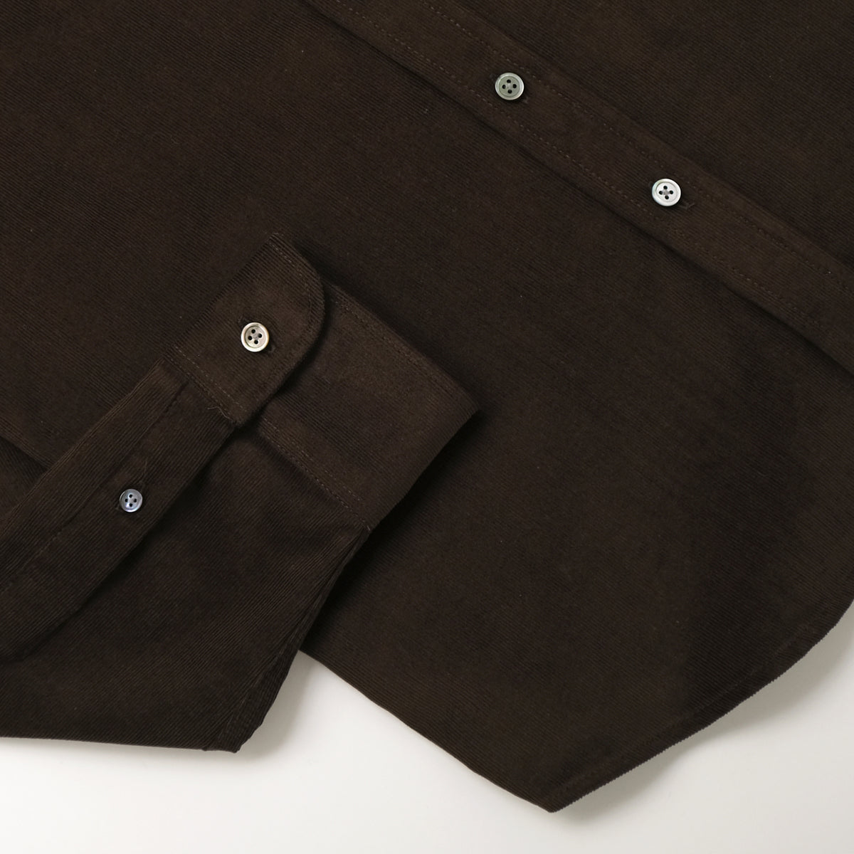 Baby corduroy shirt cuff and sleeve placket with small white button details