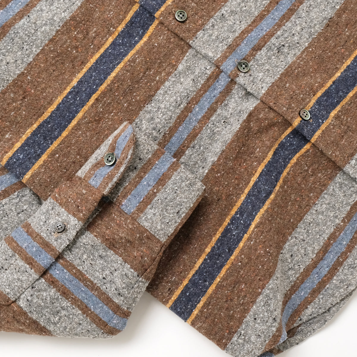 Striped long-sleeve shirt with button detail and brown, gray, and blue horizontal bands