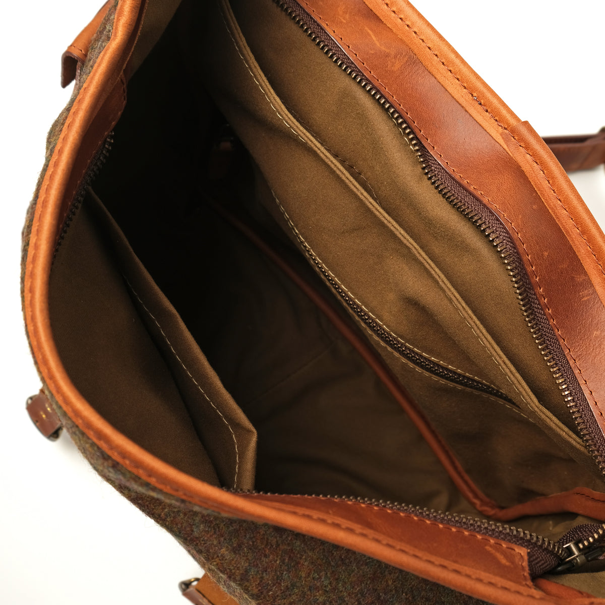 Interior view of wool messenger bag with zippered pocket and leather lining