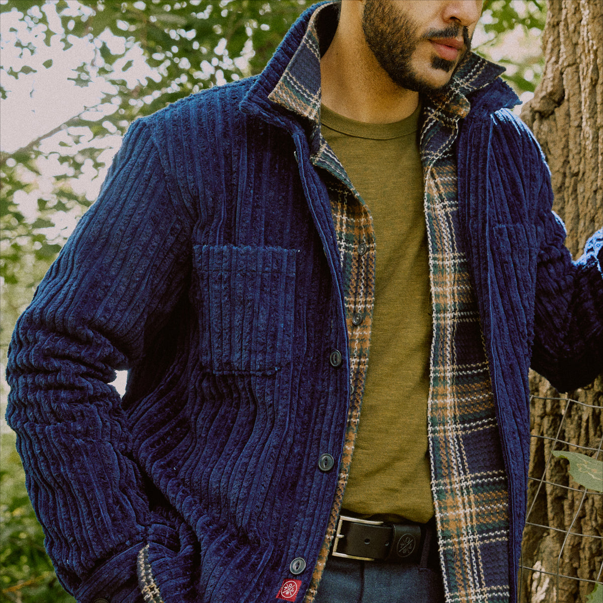 Dark navy corduroy club shirt with button front, flap chest pockets, long sleeves