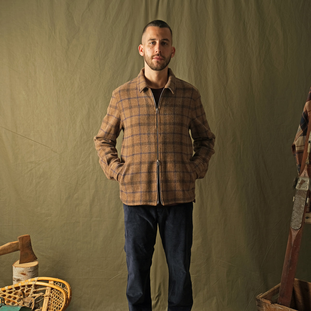 Wool plaid zip overshirt front view on model, stand collar, full zipper, relaxed fit