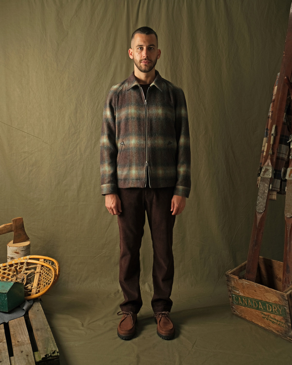 Plaid wool harrington jacket on model, straight-on view with zipper and collar