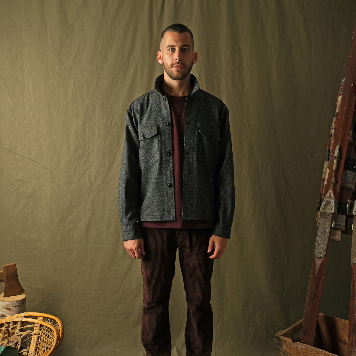 Wool camp shirt in dark charcoal speckled flecks, long sleeves, button front.