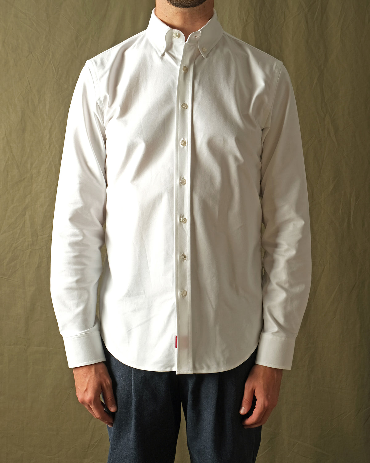 White Oxford button-up shirt view with spread collar and long sleeves