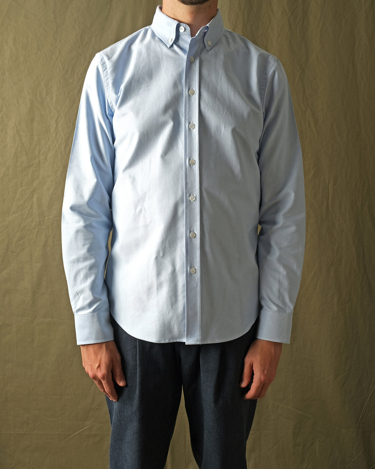 Light blue oxford button-up shirt with long sleeves and front buttons