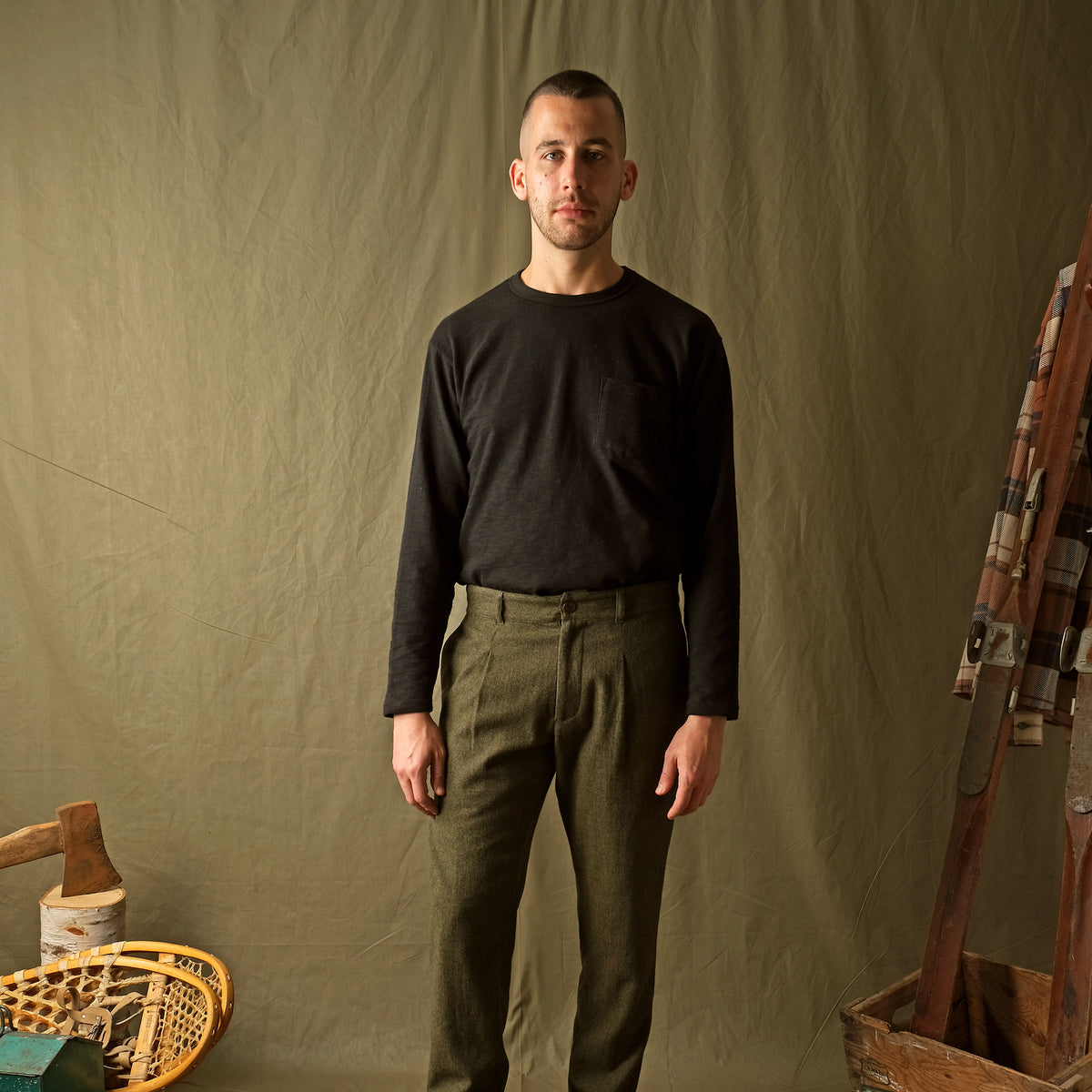 Olive washable wool pleated pants with button fly and belt loops, straight legs