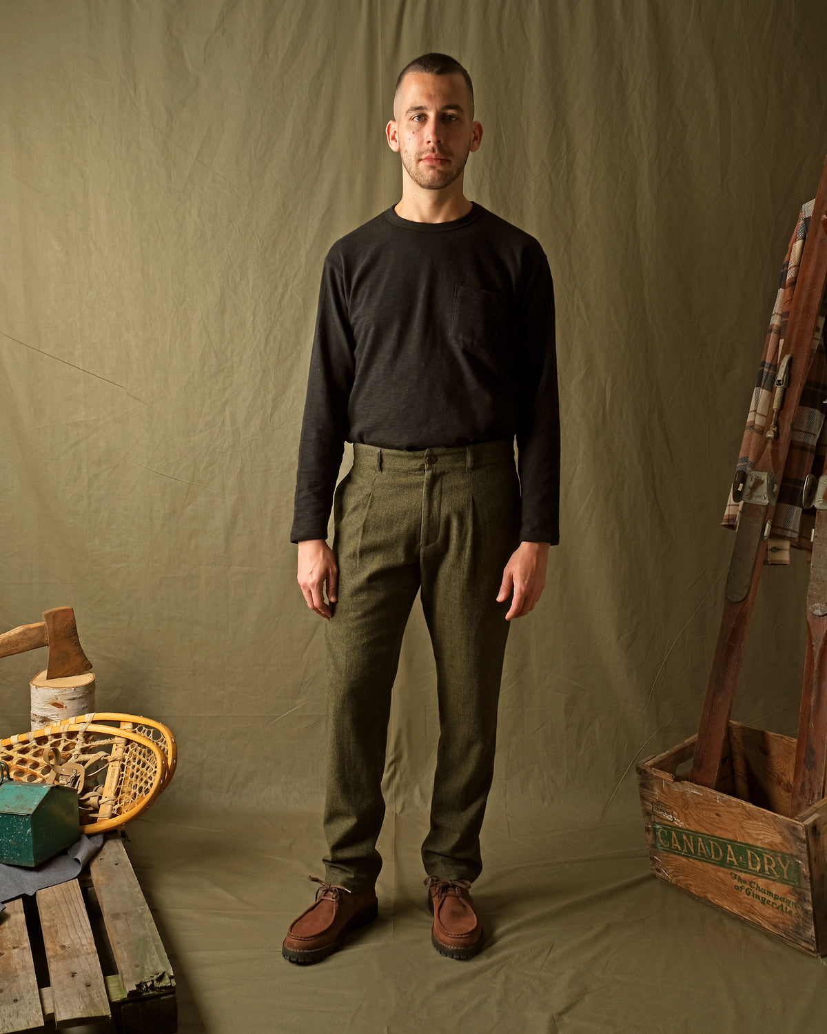 Olive washable wool pleated pants with button fly and belt loops, straight legs