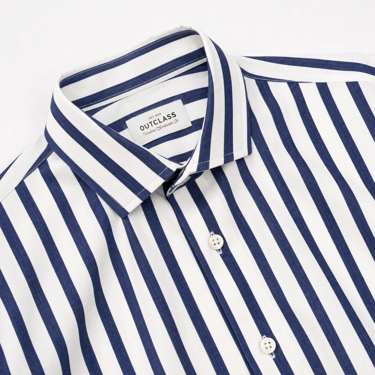 Navy-and-white striped dress shirt collar with button placket and white buttons