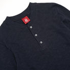 Navy henley neckline with ribbed collar and three front buttons