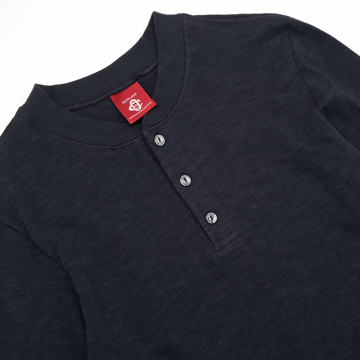 Navy henley neckline with ribbed collar and three front buttons