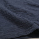 Navy double-slub henley fabric with textured knit pattern