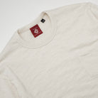 Ecru crew-neck long-sleeve T-shirt with chest pocket and neck tag