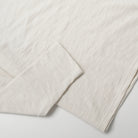 Ecru long-sleeve T-shirt sleeve with ribbed cuff and slub weave texture