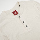 Ecru henley long-sleeve shirt with buttoned V-notch placket