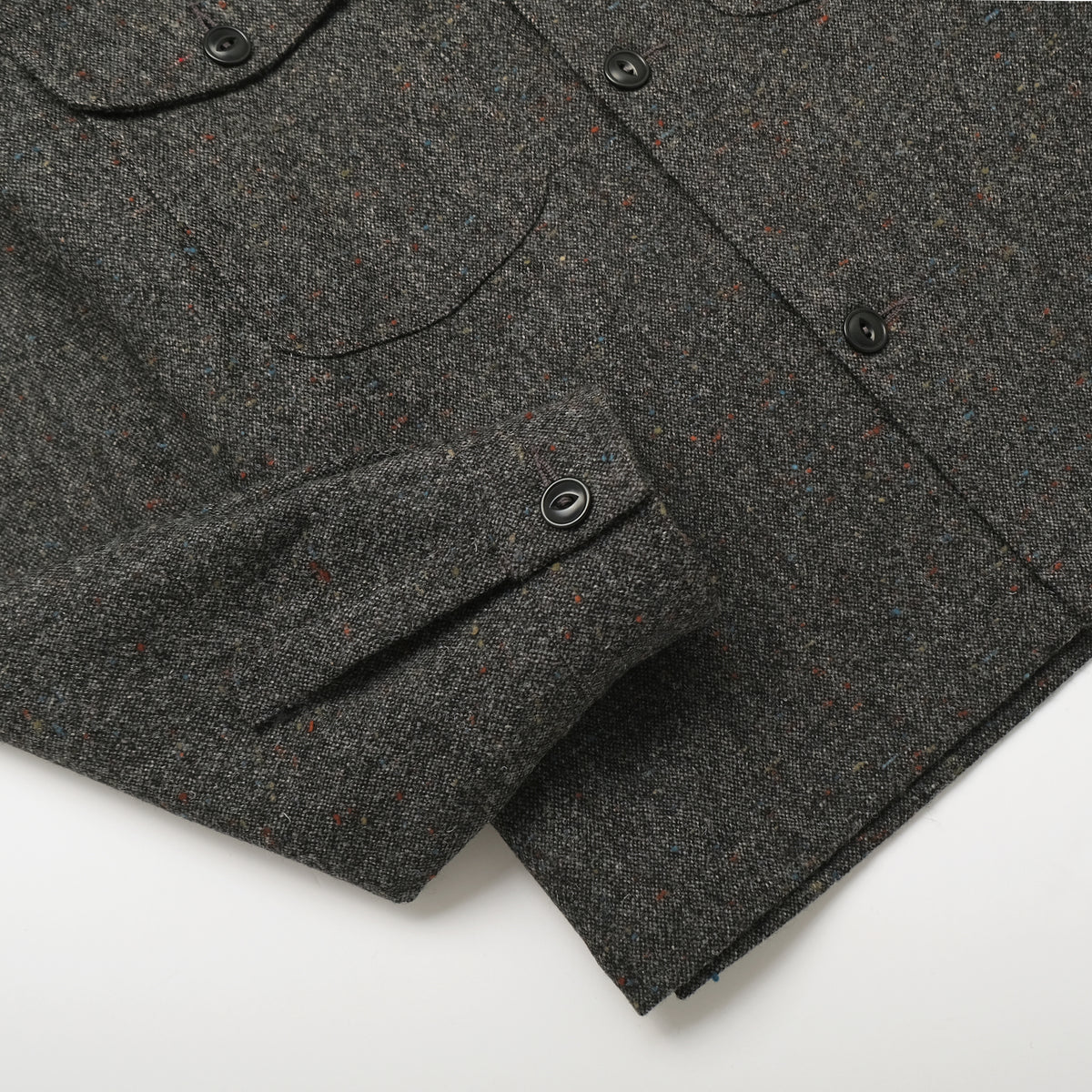 Charcoal fleck wool camp shirt, angled view showing button placket and patch pockets.
