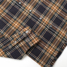 Tartan plaid easy shirt with buttoned placket and chest yoke, navy, tan, and orange