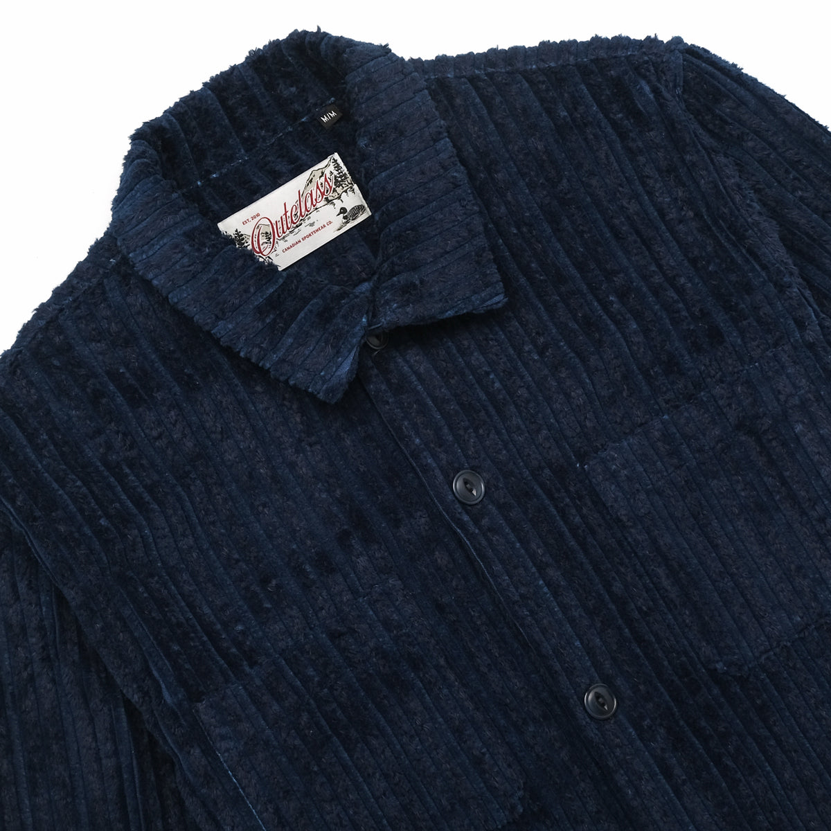 Navy jumbo corduroy club shirt close-up, textured fabric and buttoned collar