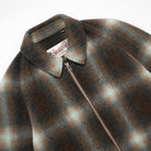 Close-up of plaid wool harrington jacket collar and front zipper
