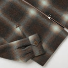 Placket and zipper close-up on plaid wool harrington jacket with metal zipper pull