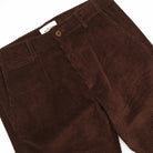 Dark brown corduroy camp pants with belt loops, front button closure, side pockets.