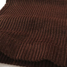 Dark brown wide-wale corduroy fabric with vertical ribbed texture.