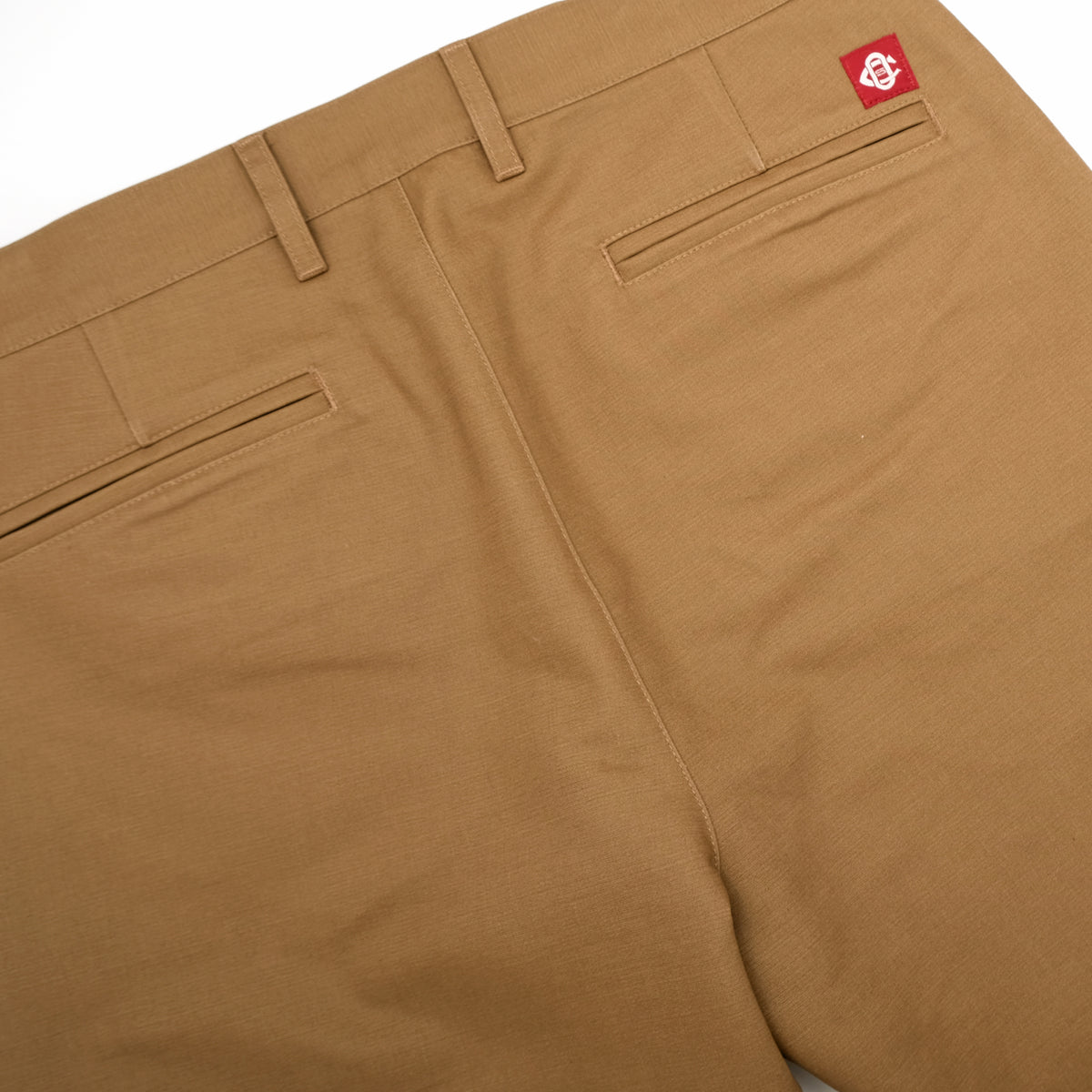 Tan moleskin engineer pants with front slash pockets and a back welt pocket