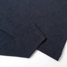 Navy long-sleeve T-shirt hem and sleeve cuff detail