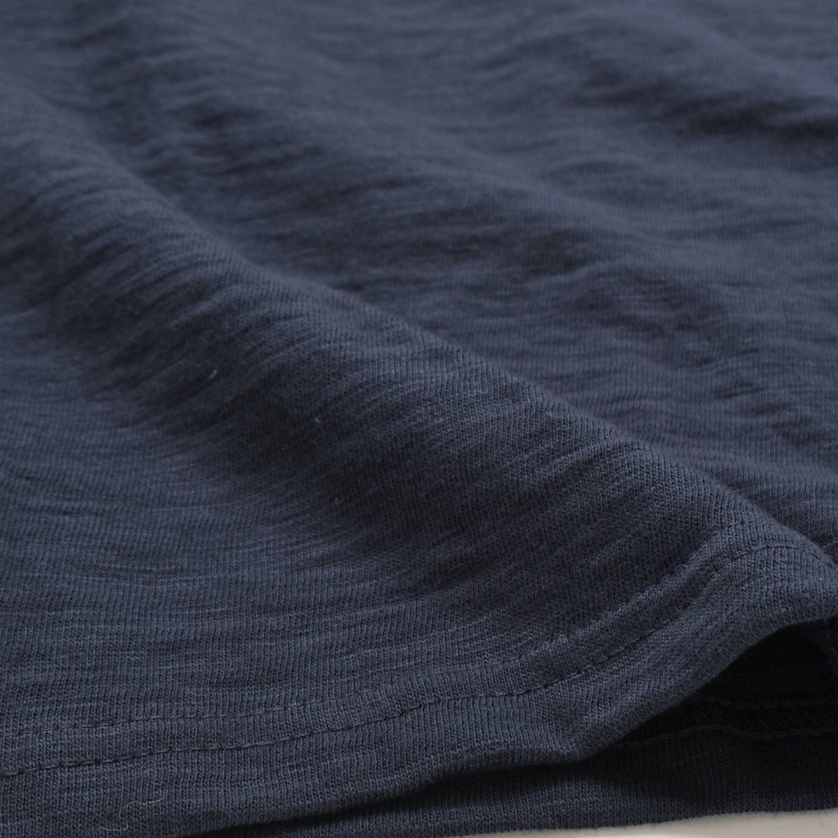Navy long-sleeve slub T-shirt fabric close-up
