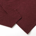Maroon long-sleeve T-shirt cuffs and hem detail, double slub knit.