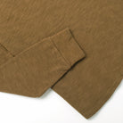 Olive double slub long-sleeve henley with ribbed cuffs and softly curved hem
