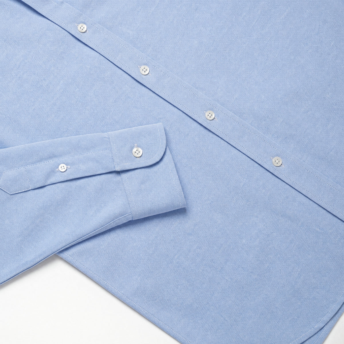 Light blue Oxford shirt cuff and shoulder yoke with button detail