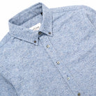 Light blue fleck flannel button-up shirt, chest pockets and front placket with buttons
