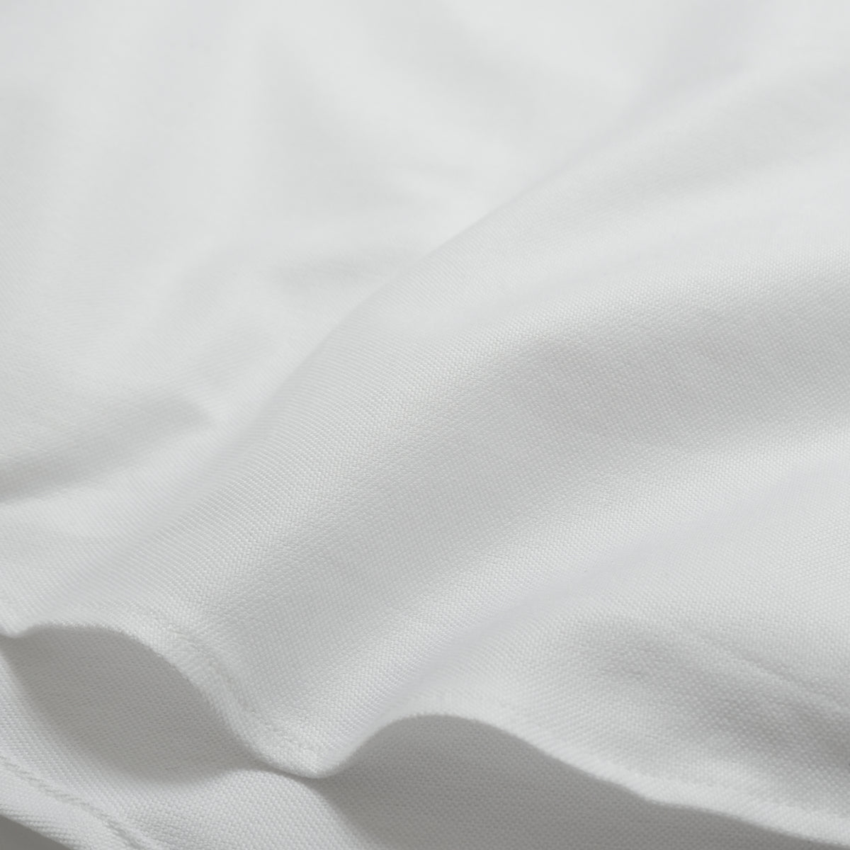 White Oxford fabric close-up with fine textured weave