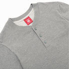 Heather grey slub long-sleeve henley with three-button placket and crew neckline