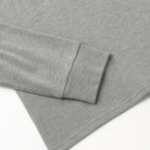 Heather grey slub long-sleeve henley cuff and sleeve seam detail