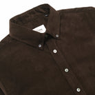 Baby corduroy classic shirt with pointed collar, placket buttons, and curved hem