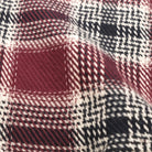 Maroon plaid flannel fabric with cream and black check pattern