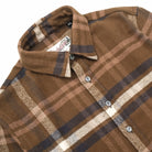 Plaid easy shirt collar with snap-style buttons and contrasting inner placket