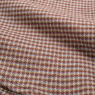 Micro check flannel fabric texture in brown with red and blue flecks