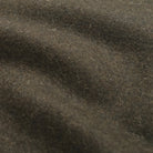 Olive wool fabric close-up with textured weave