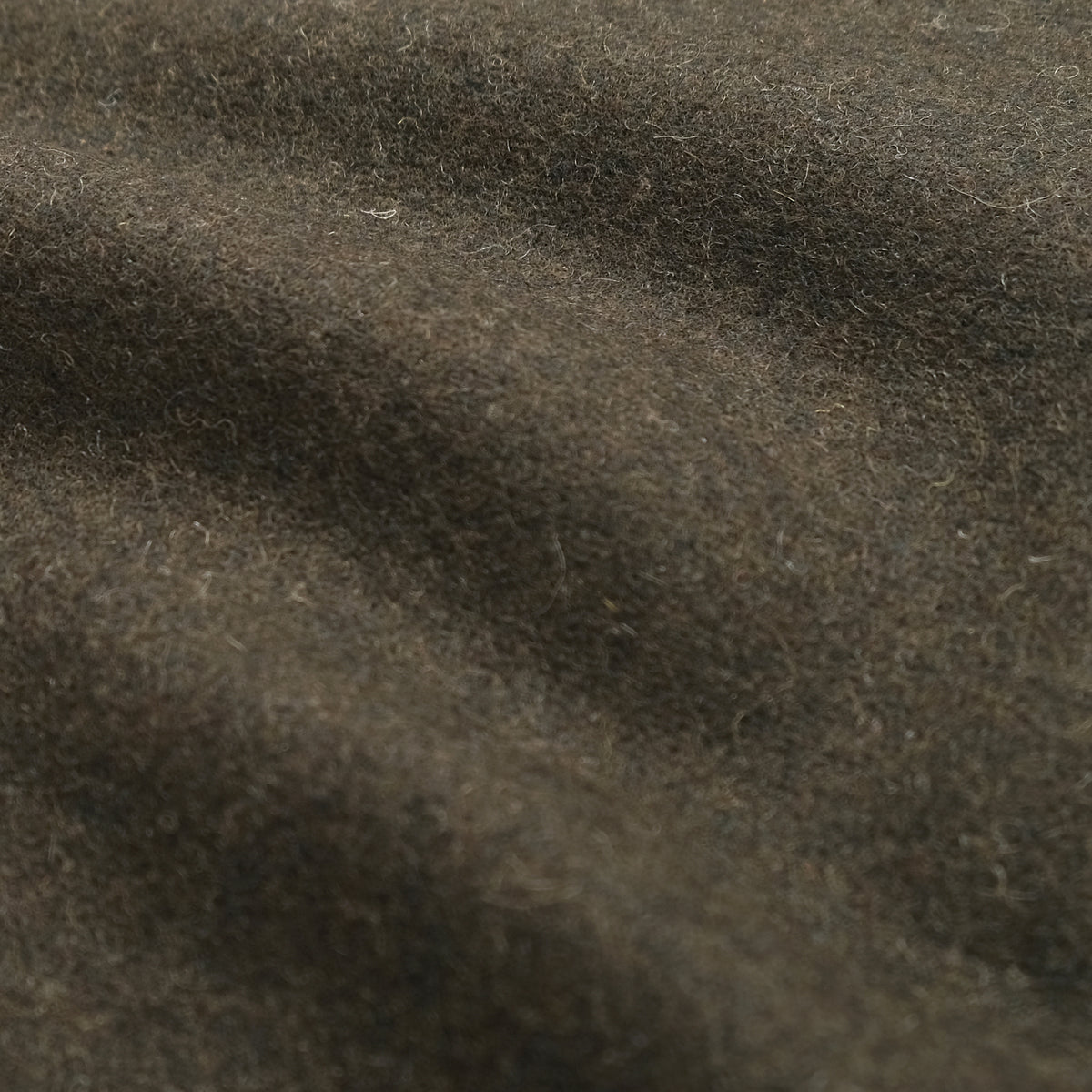 Olive wool fabric close-up with textured weave
