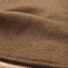 Close-up of brown stadium jacket fabric texture