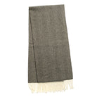 Charcoal herringbone scarf with fringed hem, straight laid