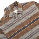 Striped button-up shirt, pointed collar and button placket in brown, gray, and blue