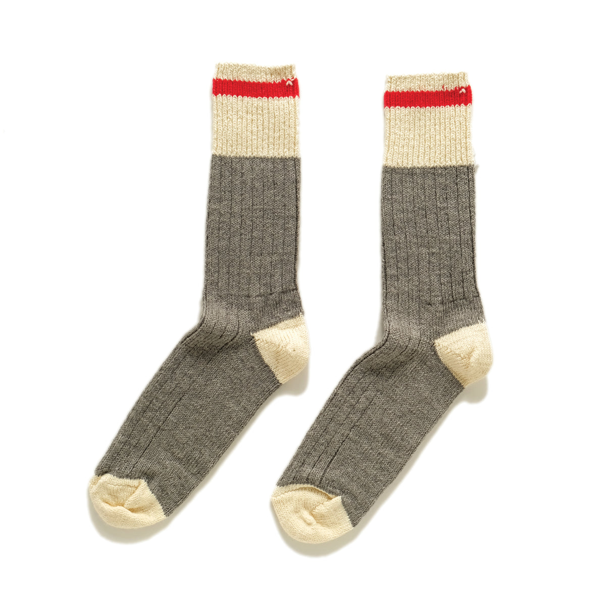 Pair of merino wool crew socks with red top stripe, gray body, cream toe cuffs