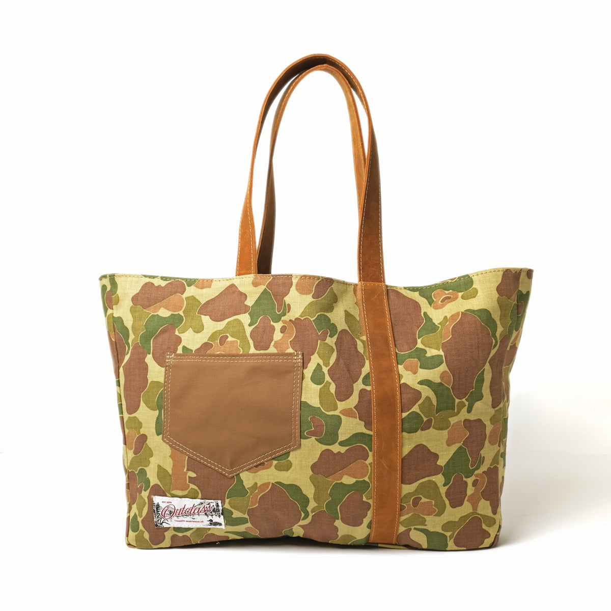 Reversible camo tote bag with brown handles and front camo pocket